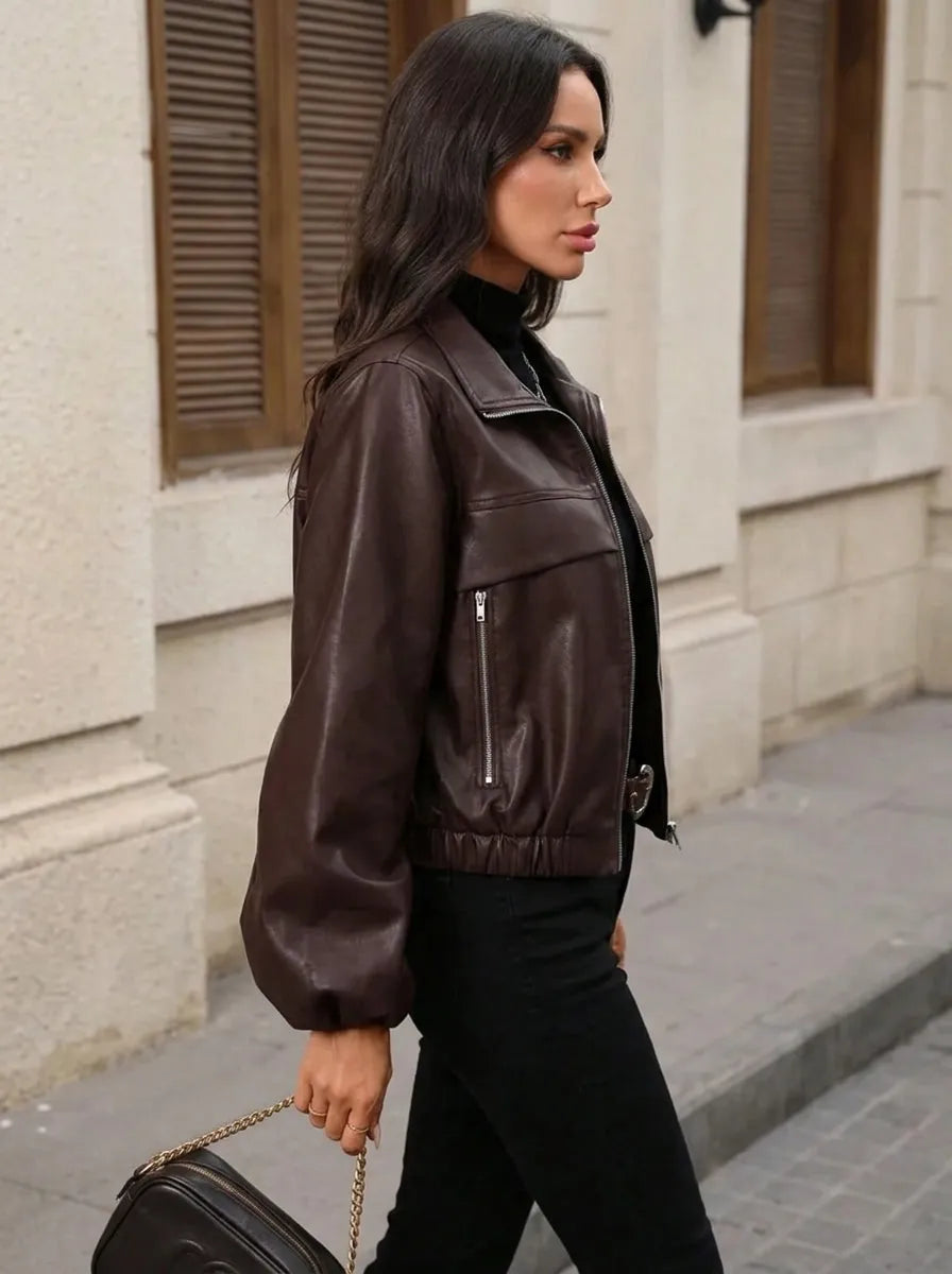 Women's cropped faux leather jacket with zippered pockets and a fitted cut